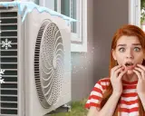 Une unité extérieure clim qui givre, avec des glaçons et des flocons de neige. Une jeune femme est choquée par ce phénomène inattendu.