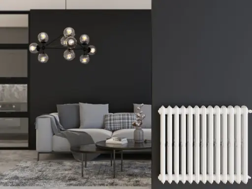 Un salon moderne avec un canapé gris, une table basse et un lustre design. À droite, un radiateur blanc classique, rappelant les anciens panneaux rayonnants.