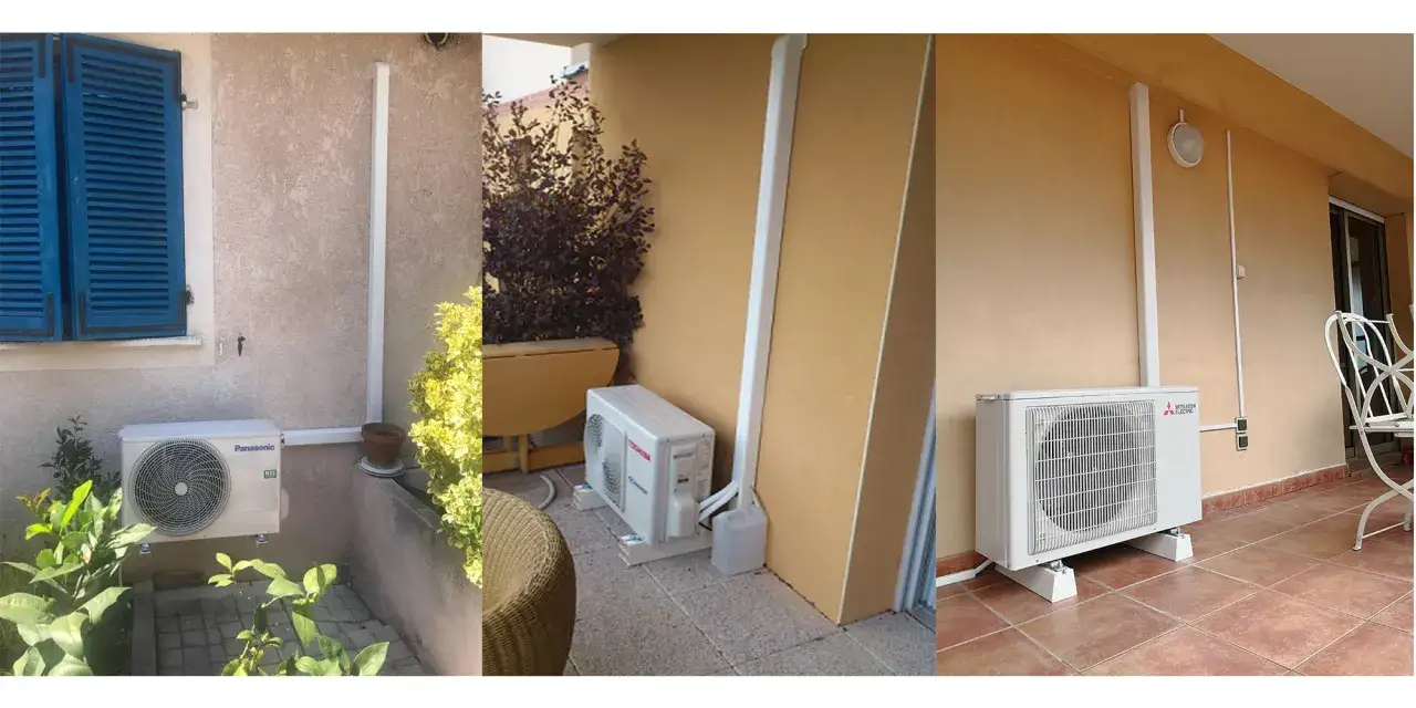 Trois unités extérieures de climatisation split, installées sur des supports, près des murs de maisons.